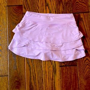 athleta girl skirt and it is lavender. Athletic were and has under shorts.